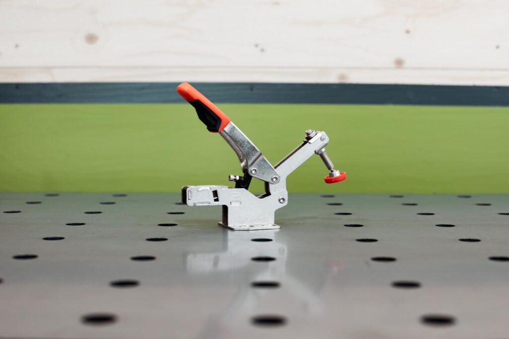 Vertical tensioner with cam